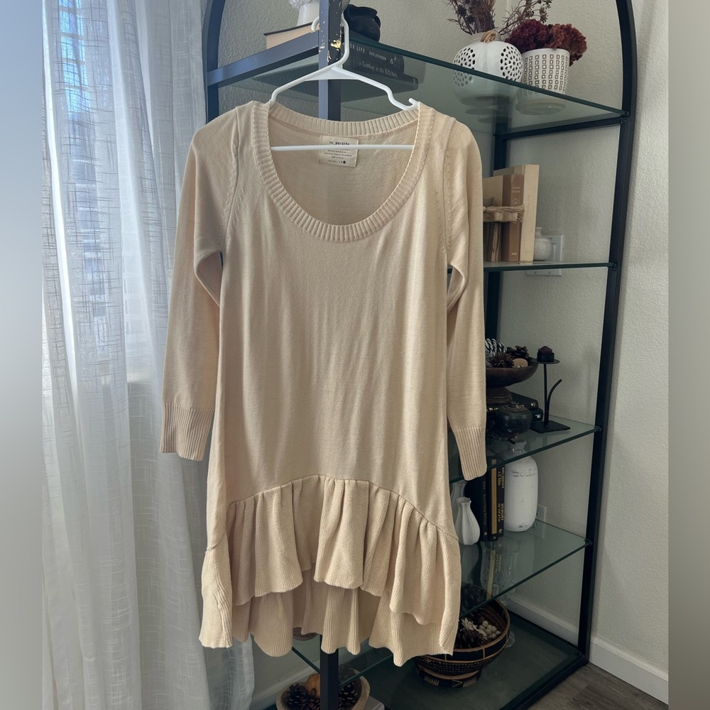 The Porsche neutral scoop neck ruffle hem tunic large